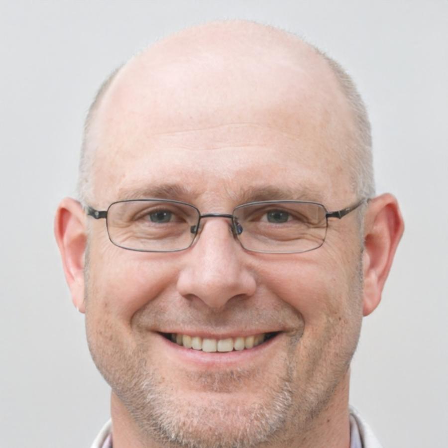 Korvex Threndale teaching game development concepts at his workstation